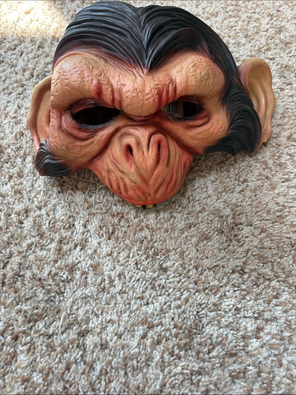 Monkey rubber head costume and black cape
